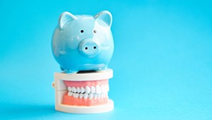 piggy bank over dentures