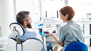 Dentist having a discussion with a patient