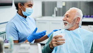 Dentist and patient discussing dentures in Odessa