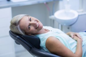 Happy woman in the dental chair