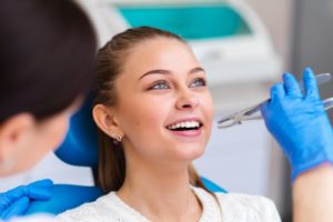 smiling patient getting a tooth extraction