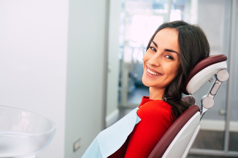 a young woman sitting in the dentist’s chair